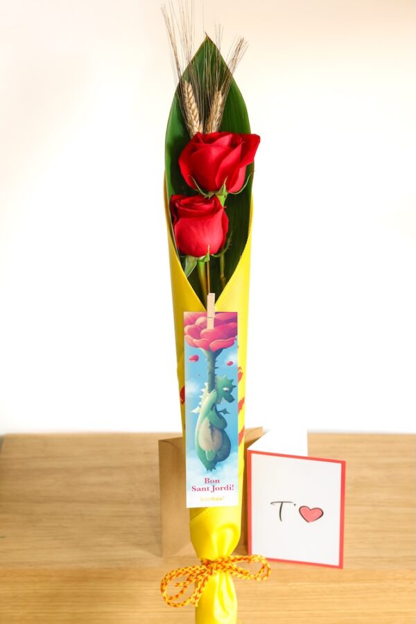 Fabric cone with two red roses and ears of wheat with bookmark and dedication card.
